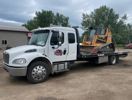 Tow truck service helping a vehicle in Langdon.