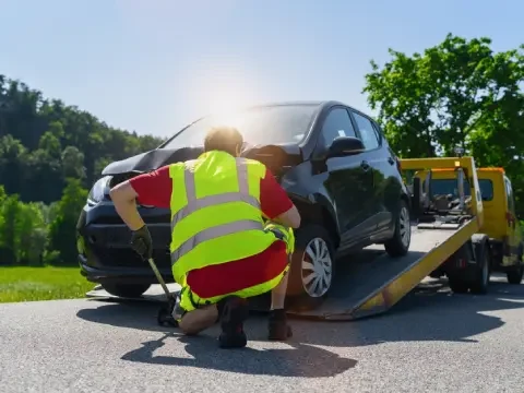 Roadside assistance tow truck helping a driver in Chestermere.