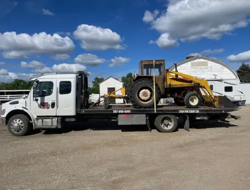 Towing service helping a driver with vehicle transport in Chestermere.