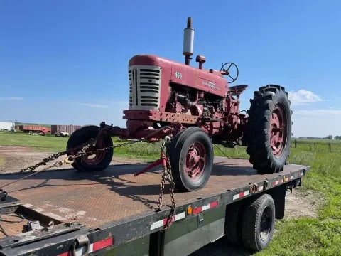 Equipment hauling service for small machinery and job-site loads in Okotoks
