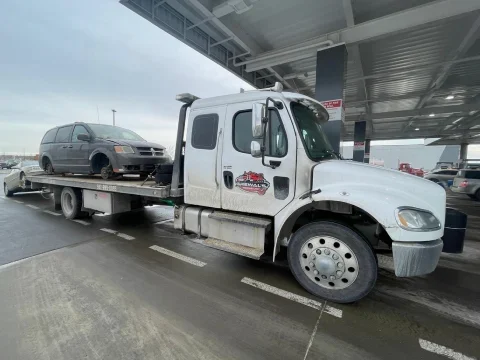 Tow truck providing service along Highway 817 near Strathmore