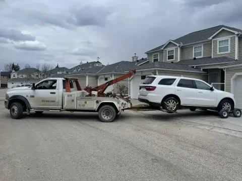 Tow truck assisting near YYC Airport in Northeast Calgary