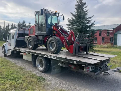 Tow truck assisting a vehicle in Northwest Calgary