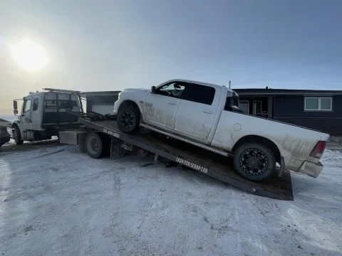Pickup truck being towed safely in Okotoks
