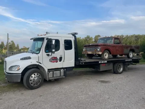 Scrap car removal service picking up an unwanted vehicle in Strathmore.