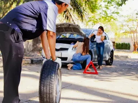 Tire change assistance for a vehicle with a flat tire in Chestermere.