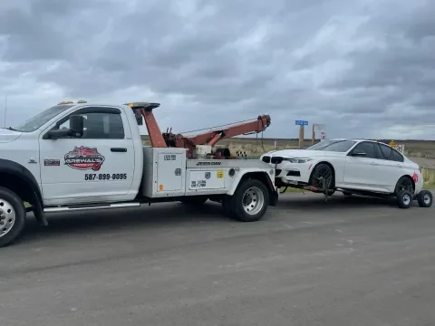 Tow truck providing roadside support on Highway 797 near Langdon.
