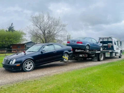 Tow truck ready for service near the Calgary skyline