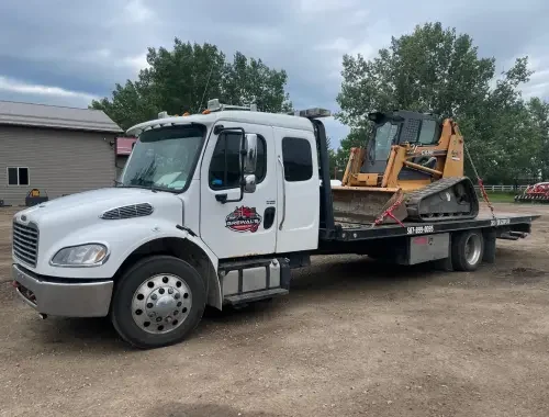 Tow truck service helping a vehicle in Langdon.
