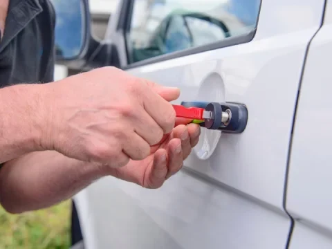 Professional car unlock service using proper tools to open a locked vehicle
