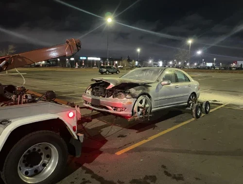What drivers should do after a vehicle collision in Alberta before arranging safe towing or accident recovery.