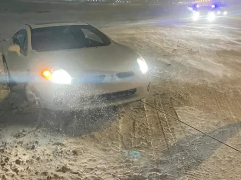 Winch-out service for a vehicle stuck in snow near Okotoks